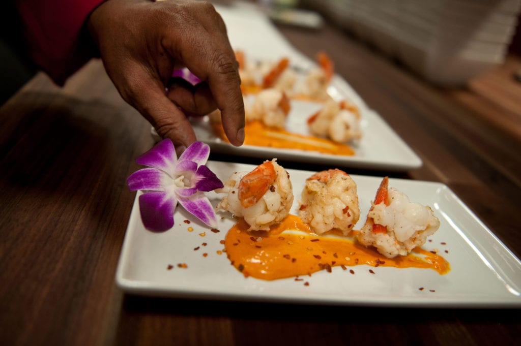 Chef Prasad plates Shrimp Piri Piri. Photo credit: Cheyney Barrieau