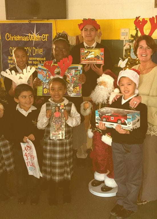 St. Brigid-St. Augustine Principal Shevon Hickey (right) with students who held a last-minute toy drive. Submitted photo