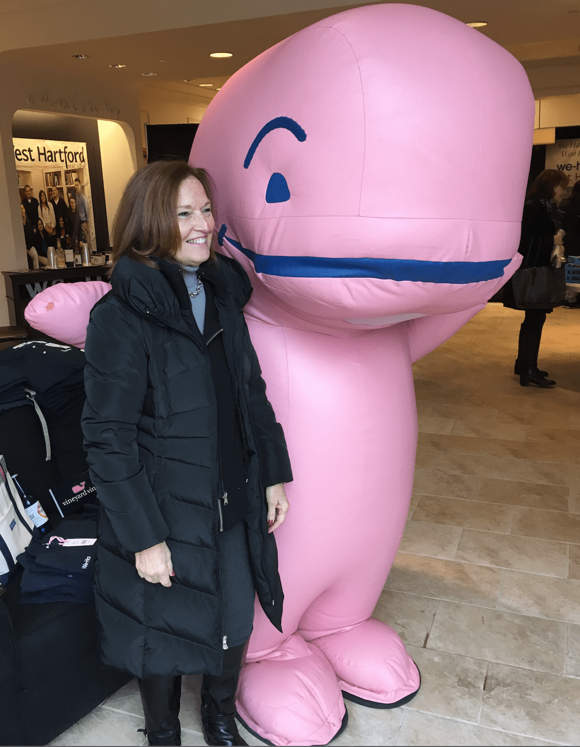 West Hartford Chamber of Commerce Executive Director Barbara Lerner with the Vineyard Vines Whale Mascot at the We-Ha Pop-Up Store in Blue Back Square. Photo credit: Joy Taylor