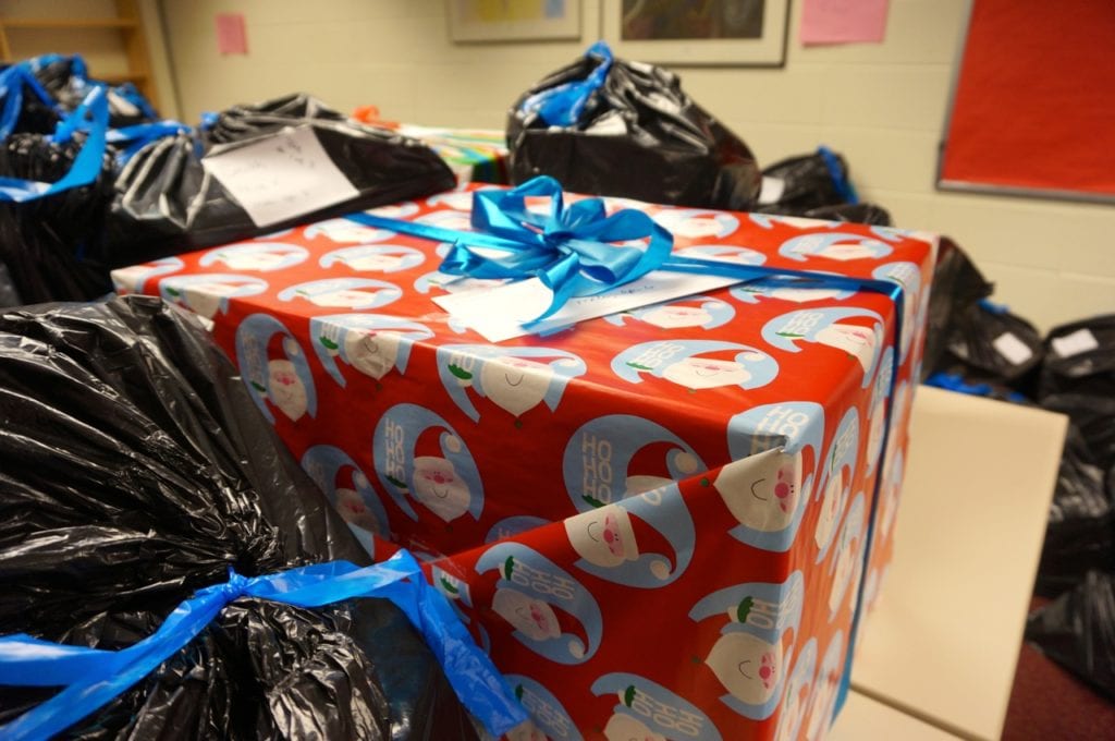 Boxes and bags of clothes and gifts purchased by Conard Holiday Helpers. Photo credit: Ronni Newton
