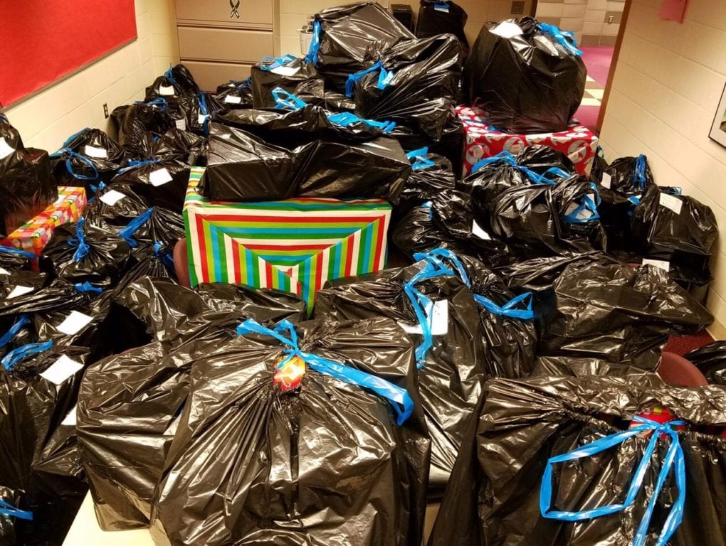 A conference room at Conard is packed full of gifts for the 76 West Hartford students who will receive them from Conard Holiday Helpers. Photo courtesy of Cindy Vranich