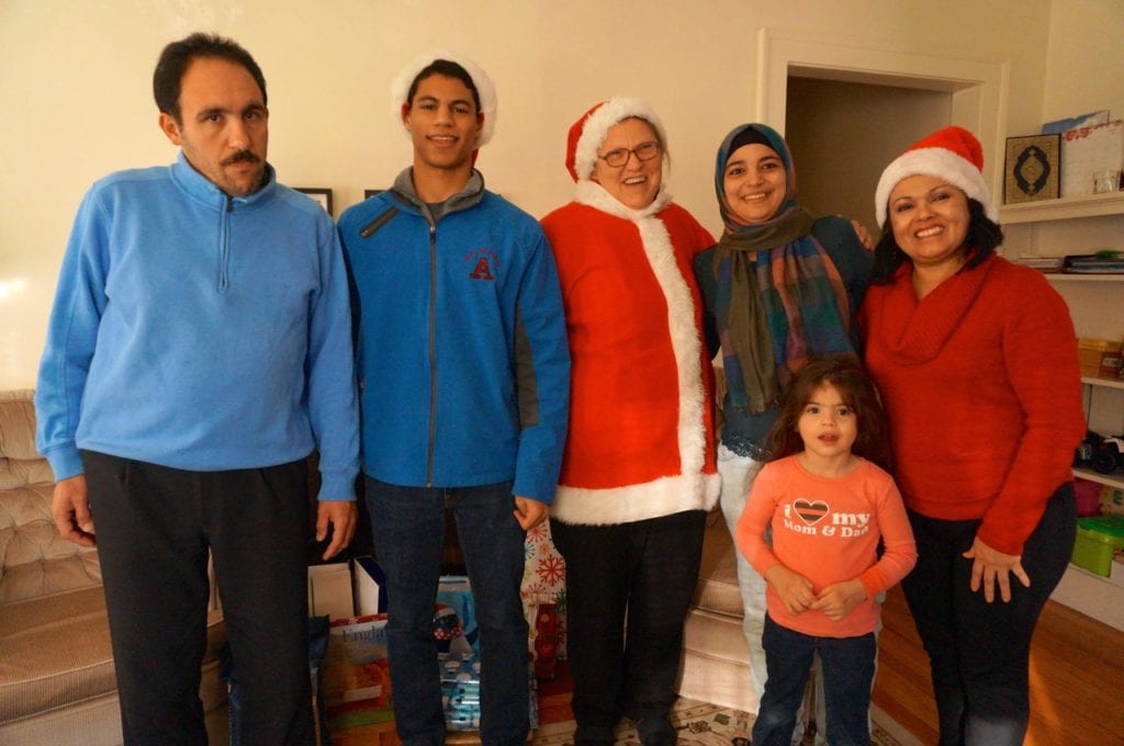 The Kattoubs with "Santa' and 'elves.' Back row (from left): Anas Kattoub, Mohammed Merraay, Nancy Latof, Arabia Kattoub, and Ana Leite. In front is Jana Kattoub. Photo credit: Ronni Newton