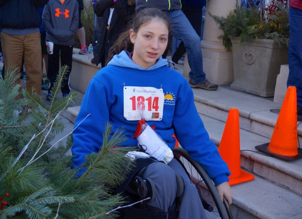 Maya Oberstein of West Hartford won the female wheelchair division. HMF Blue Back Mitten Run, West Hartford, Dec. 4, 2016. Photo credit: Ronni Newton
