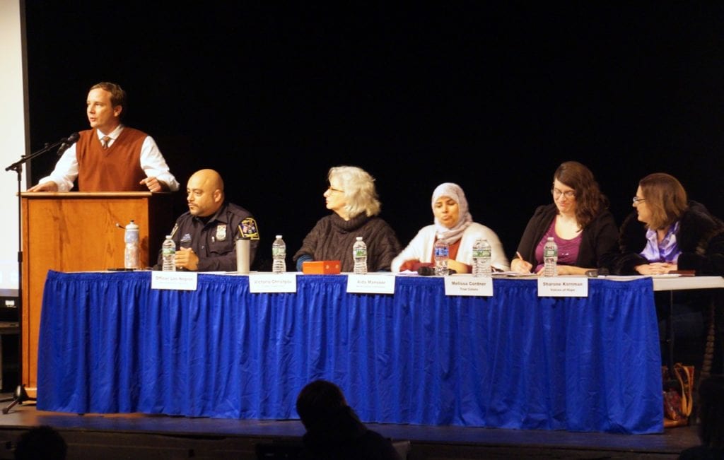 English teacher Matt West (left) moderated a panel that included (from left) West Hartford Police School Resource Officer Leo Negron, Victoria Christgau from the Connecticut Center for Nonviolence, Aida Mansoor from the Muslim Coalition of Connecticut, Melissa Cordner from True Colors, and Sharone Kornman, the daughter of two Holocaust survivors. Photo credit: Ronni Newton