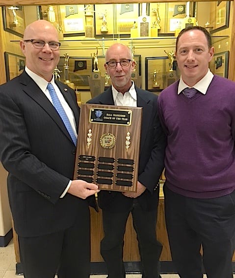 Hall tennis coach Jim Solomon (center) receives his Coach of the Year plaque from War-Chief Sports Council Co-President Paul McConnell (left) and Athletic Director Jason Siegal. Courtesy photo