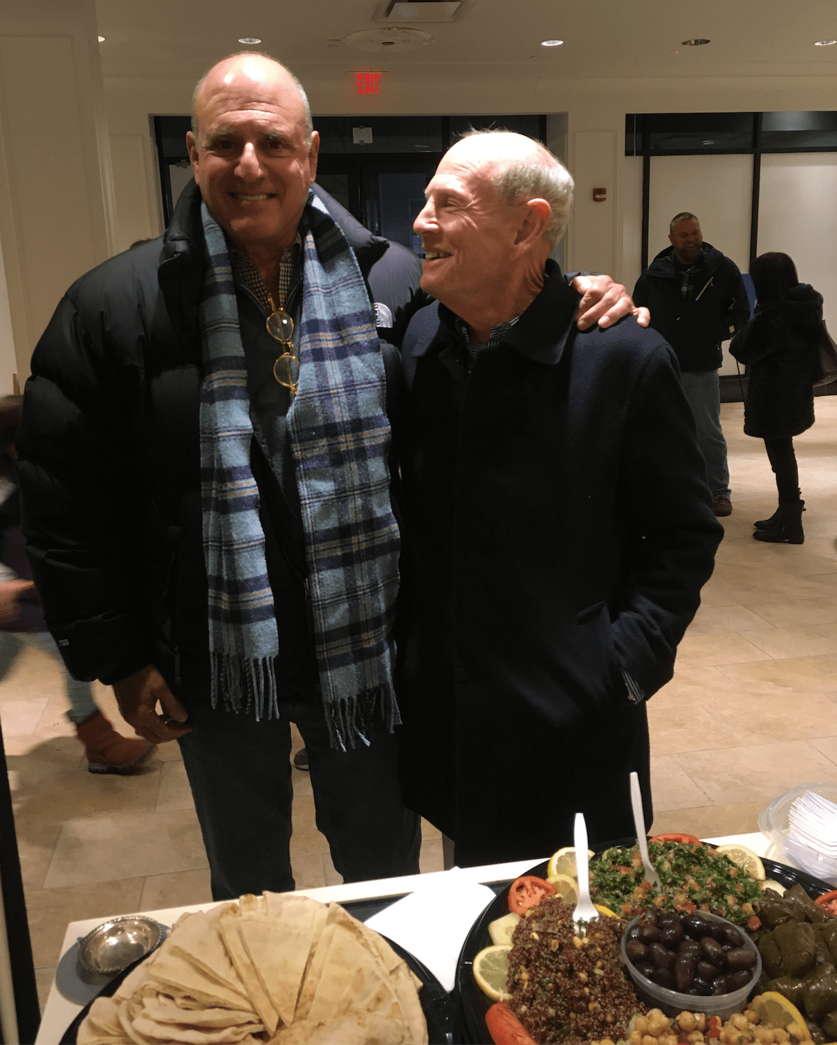 Doctors Glen Rapoport and David Epstein enjoy food by Tangiers at the We-Ha Pop-Up Store to celebrate the unique coffee lovers book by David’s son Joseph Epstein. Photo credit: Joy Taylor