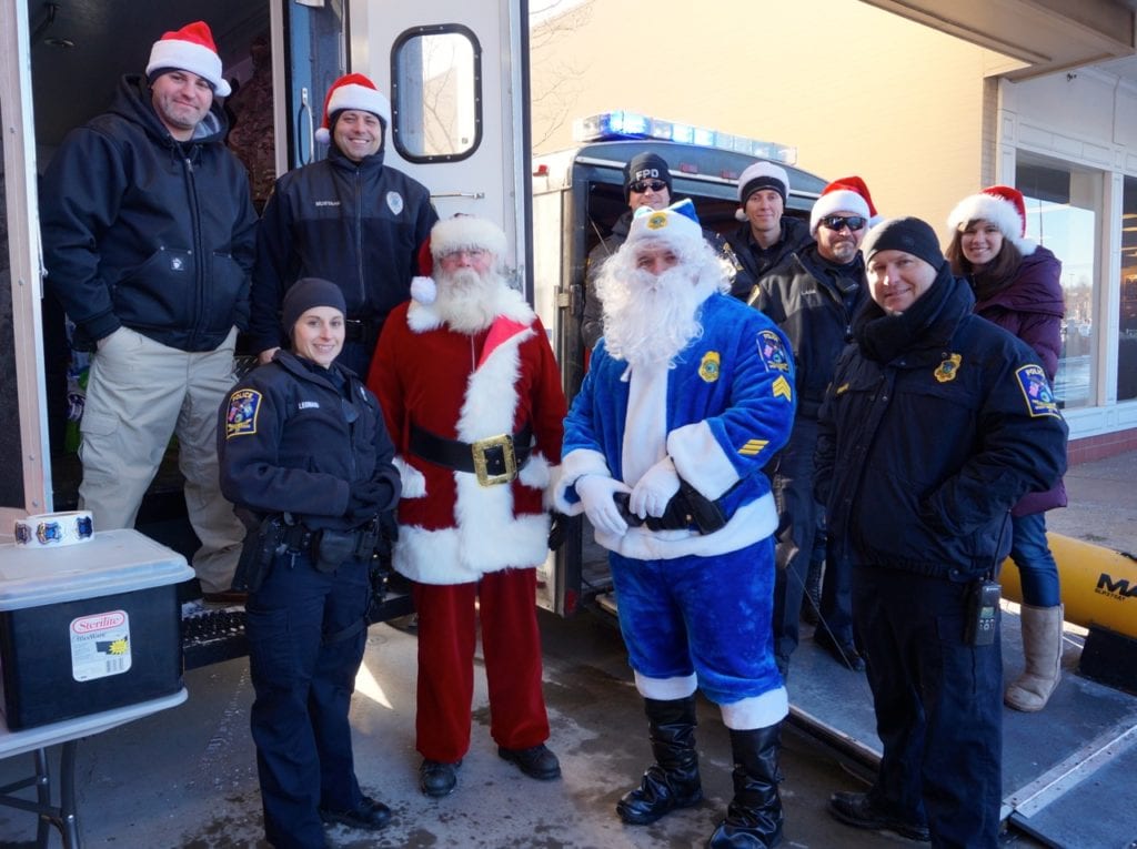 Santa Cop and another of Santa's helpers with West Hartford and Farmington Police Department members at a toy drive Dec. 16, 2016, outside the Toys R Us in West Hartford's Corbin's Corner. Amanda Moffo (far right) coordinated the combined effort. Photo credit: Ronni Newton
