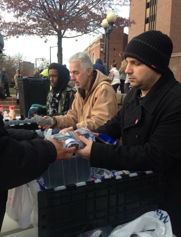 Church Army USA hands out socks collected by Braeburn Elementary School students and other items to the homeless in Bushnell Park in Hartford. Photo courtesy of Bryan Bywater