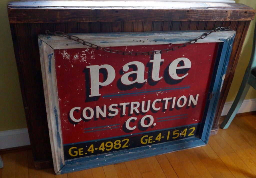 A variety of vintage construction signs fill Jim Healy's house. Based on the phone number, he traced the sign to Brooklyn, NY. Photo credit: Ronni Newton