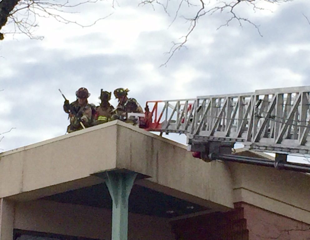 Firefighters on the roof of 977 Farmington Ave. in West Hartford Center. Courtesy photo