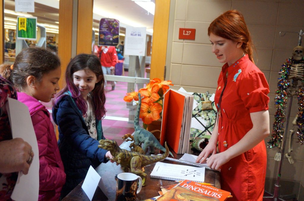 Katherine Gregory as Miss Frizzle from Magic School Bus gives a lesson about T-Rex to Charter Oak International Academy students. Conard Fictional Characters Day. Photo credit: Ronni Newton