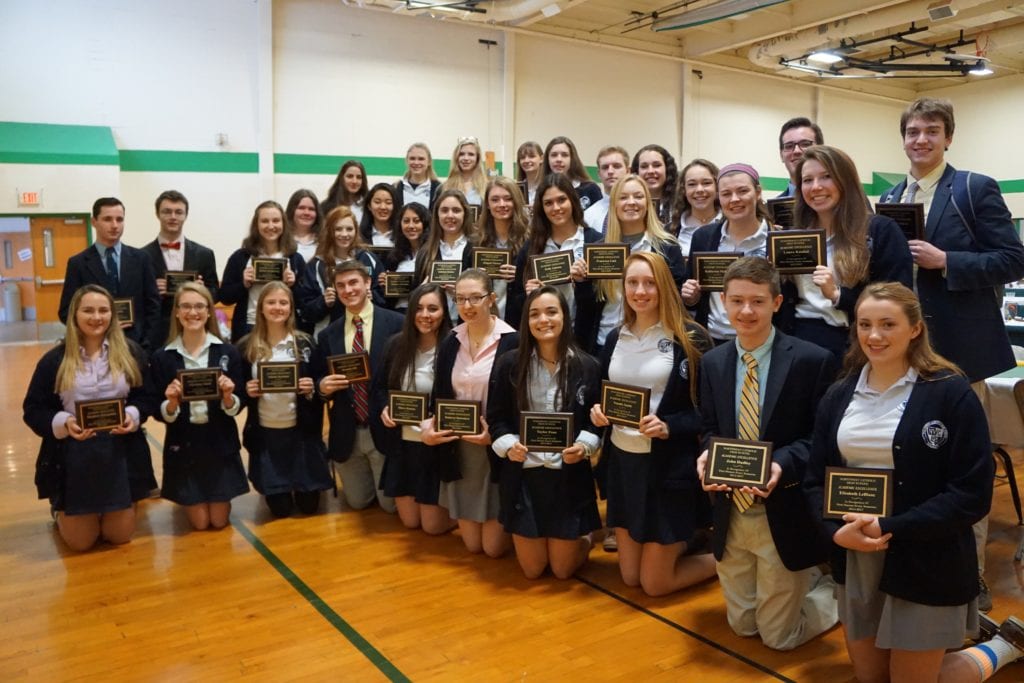 Northwest Catholic High School seniors proudly display their plaques earned by achieving First Honors every semester since they began as freshmen. Pictured: Brett Baker, Leanna Beaulieu, Rachel Conover, Kamryn Desrosiers, Gabriela Doskos, John Dudley, Veronica Eskander, Abigail Flower, Kelly Galeota, Brendan Gill, Christina Gluch, Katharine Jessen, Sarah Jessen, Maeve Kearns, Katelyn Konigsberg, Laura Kunkel, Elizabeth LeBlanc, Francesca Link, Joseph Morelli, Katherine Mullen, Claire Nicholas, Kennedy O’Hara, Emilia Palascak, Taylor Pane, Ellen Paradise, Theadora Petropoulos, Christopher Poniatowski, Valeria Seymour, Natalie Smith, Joshua Vallera, Shane Walsh, Mary Wood, Angel Zohrabian. Not pictured: John Allen, Brynna Ledwidge, Allyson Voelker. Submitted photo