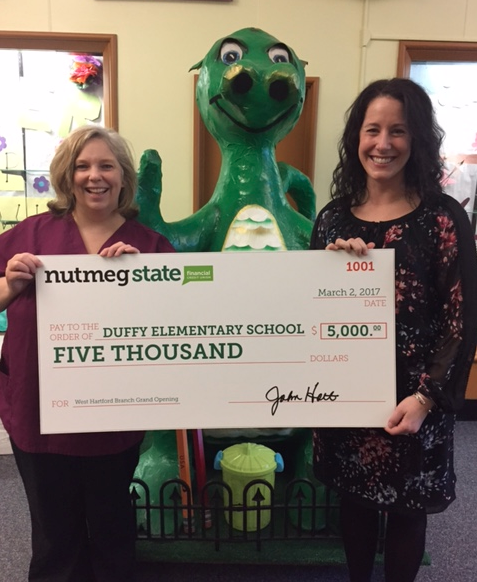 Duffy PTO President Joy Russell (left) and Principal Kristi Laverty hold the check for $5,000 they received from Nutmeg State Financial Credit Union in the townwide public school contest. Photo credit: Leslie Carpenter