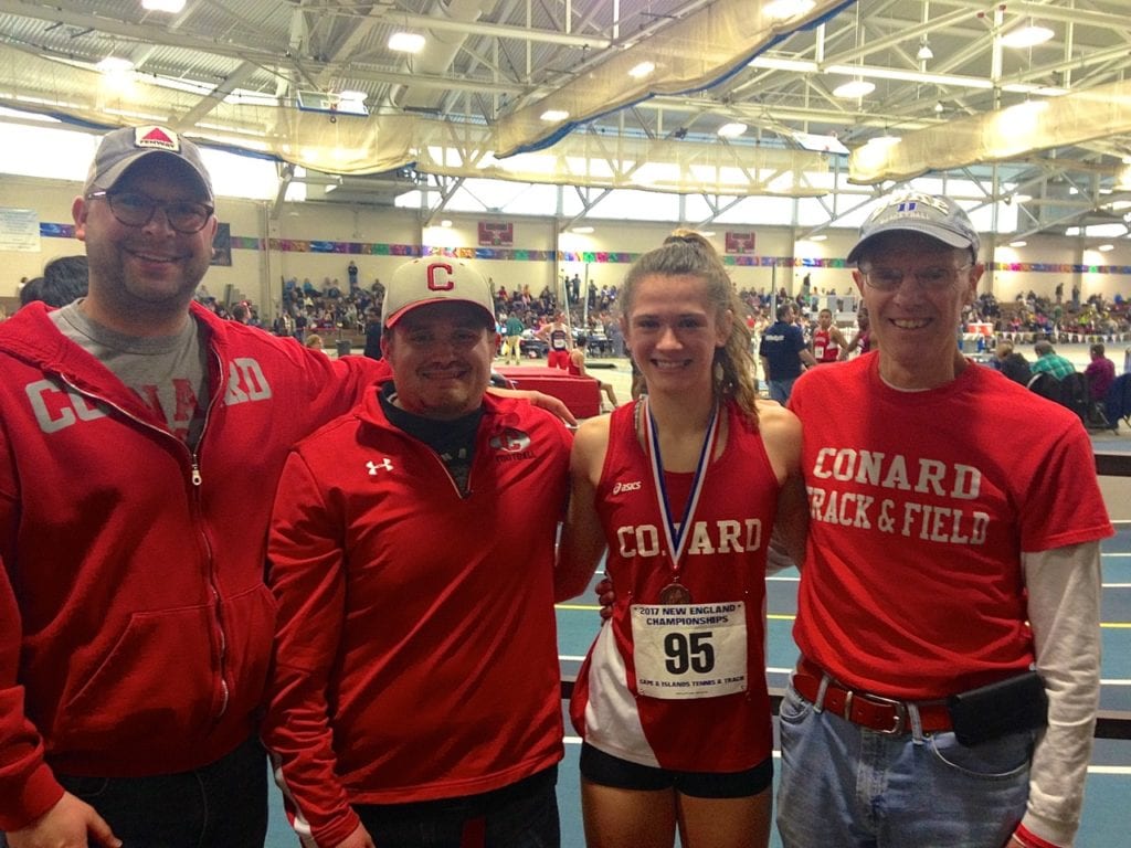 Libby McMahon with her dedicated coaches at the New England Championships. From left: Head coach John Provencher, James Redman, McMahon, and Stephen Chase. Photo courtesy of Christine McMahon