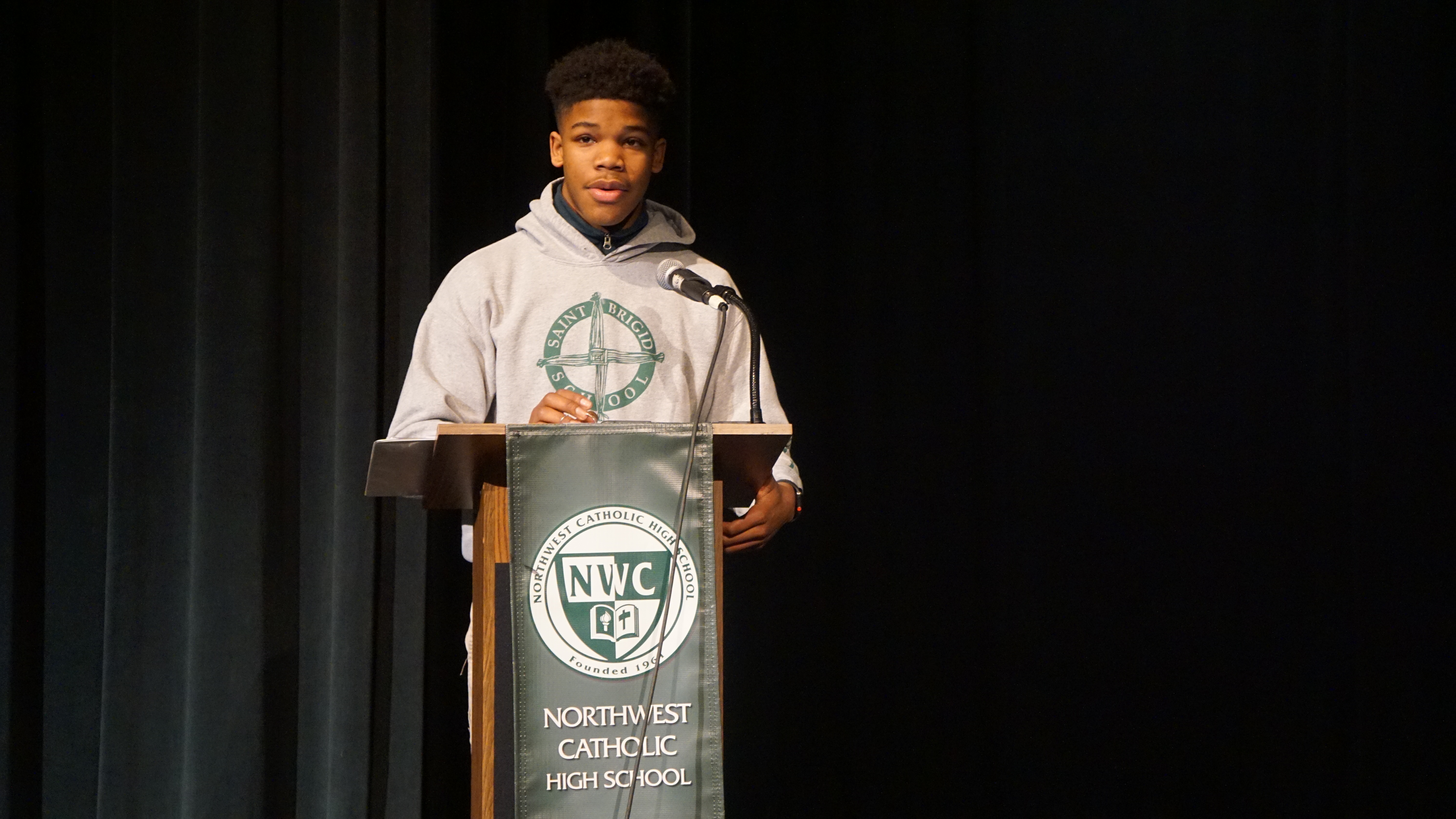 Northwest Catholic’s Evan Thompson, a junior from Bloomfield, delivers the keynote address at convocation as part of the school’s celebration of Black History Month