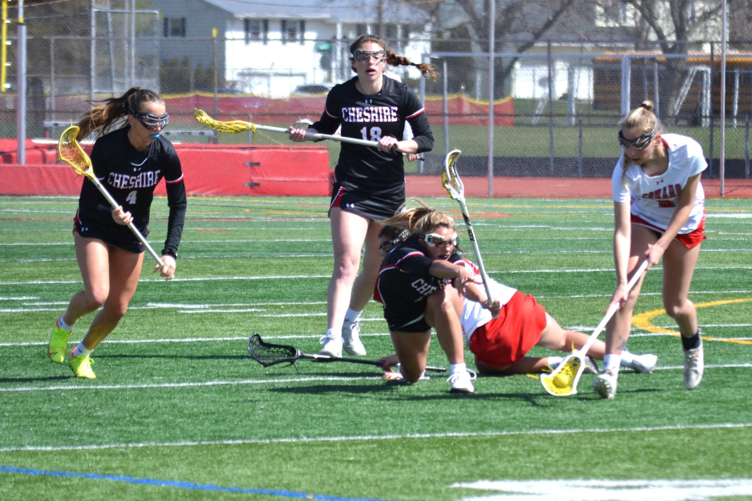 Ruby Czajkowski comes up with the loose ball just ahead of a Cheshire player