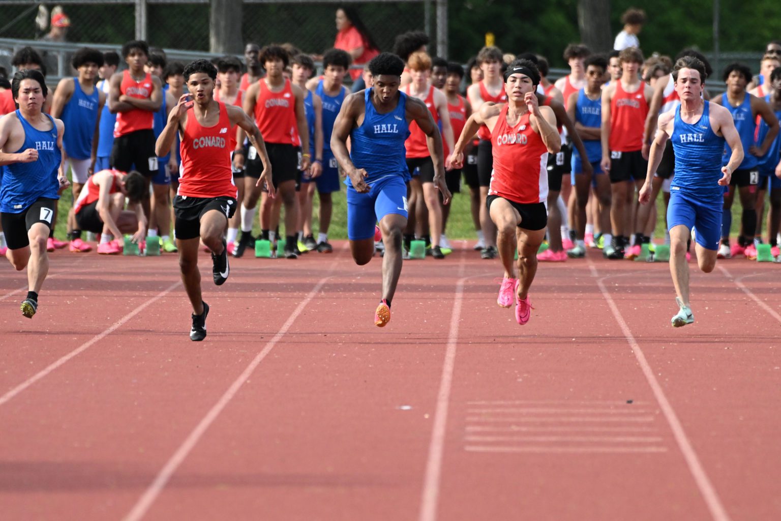 Crosstown Rivalry Leads to Great Performances for Hall and Conard Track and Field WeHa West