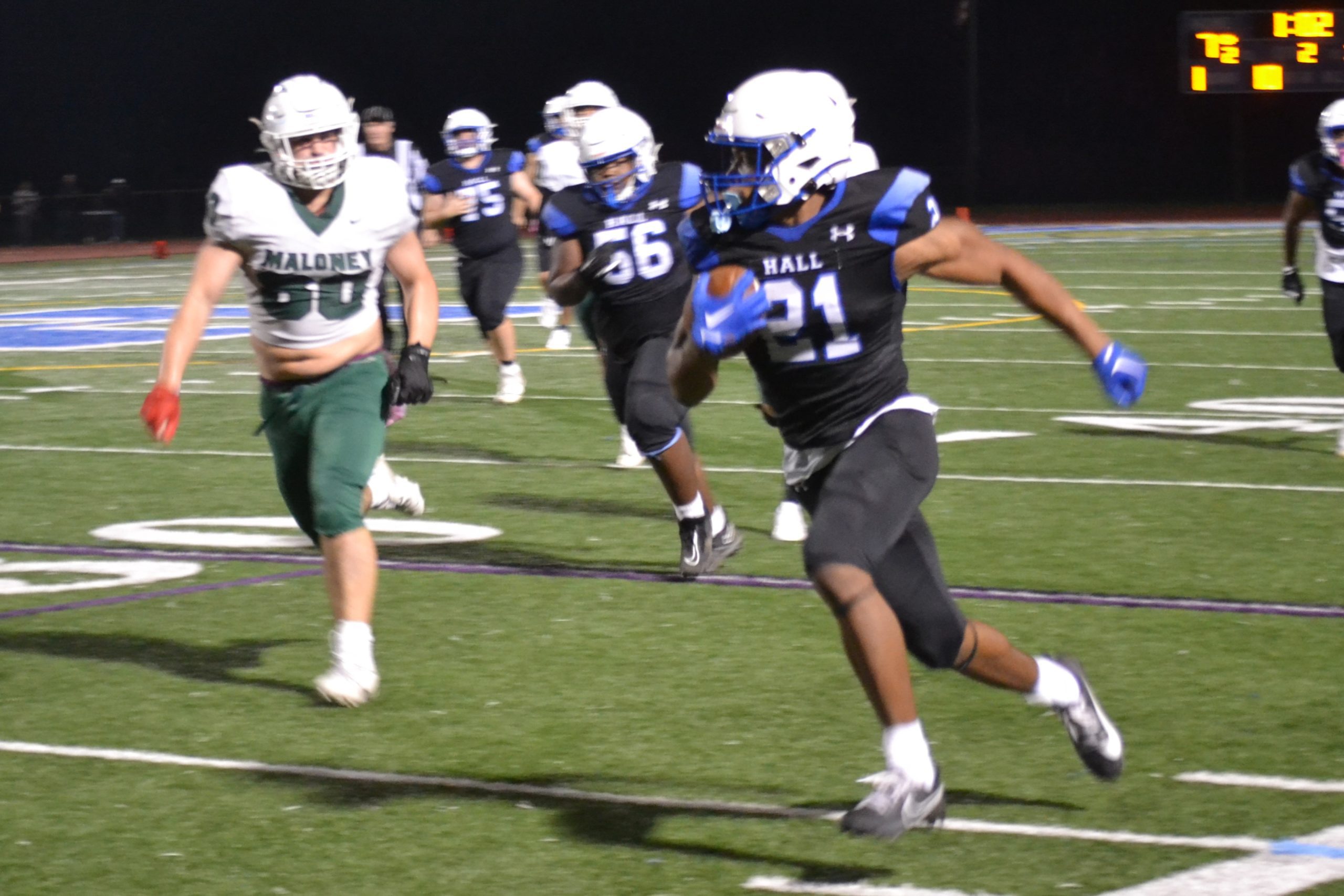Jordan Brice of Hall of Hall runs away from a would-be tackler