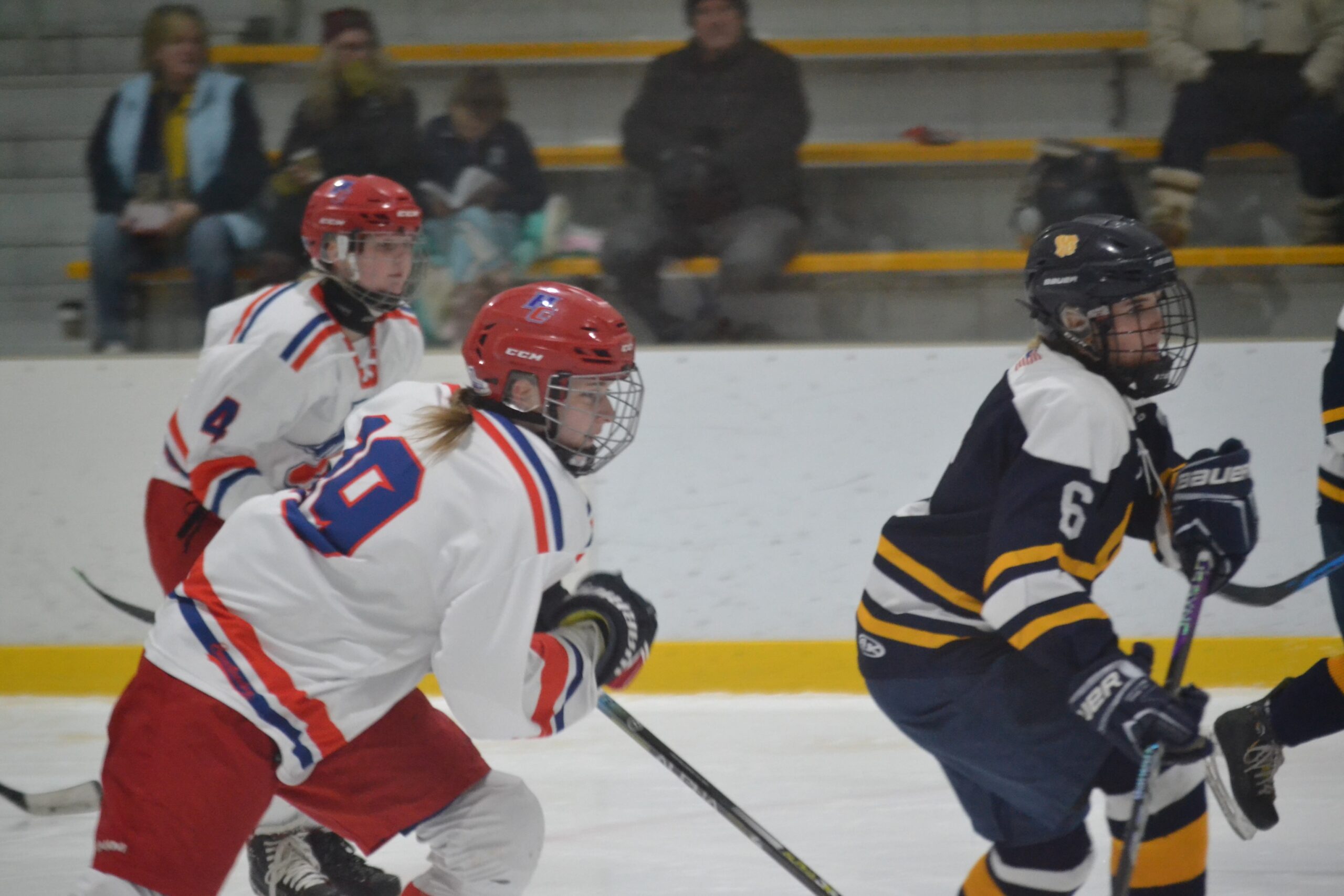 Avery Wolfe (19) and Stella Poulin move into the offensive zone for the  WarChiefs - We-Ha