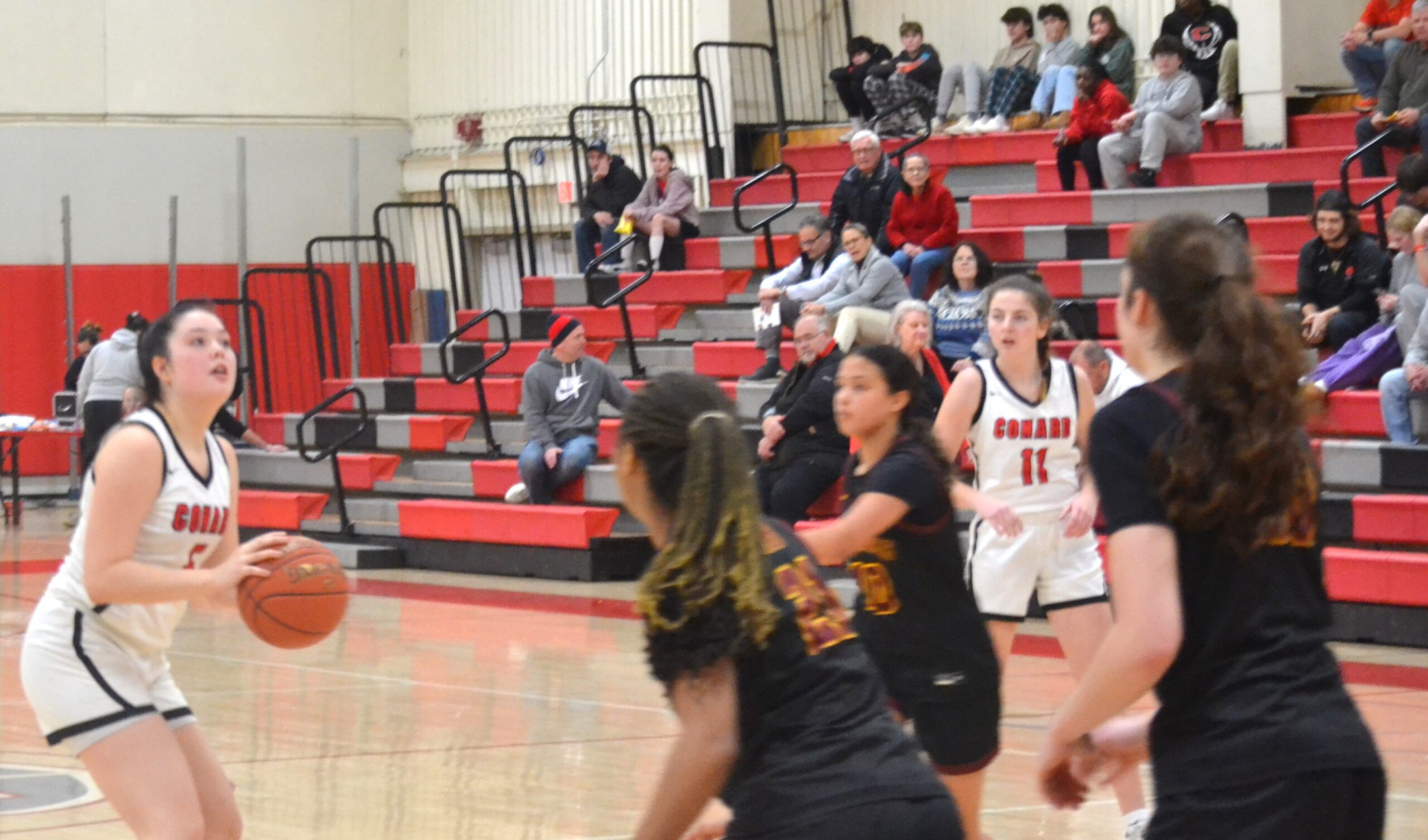 Kathryn Trola, the only senior starter for Conard, eyes the basket