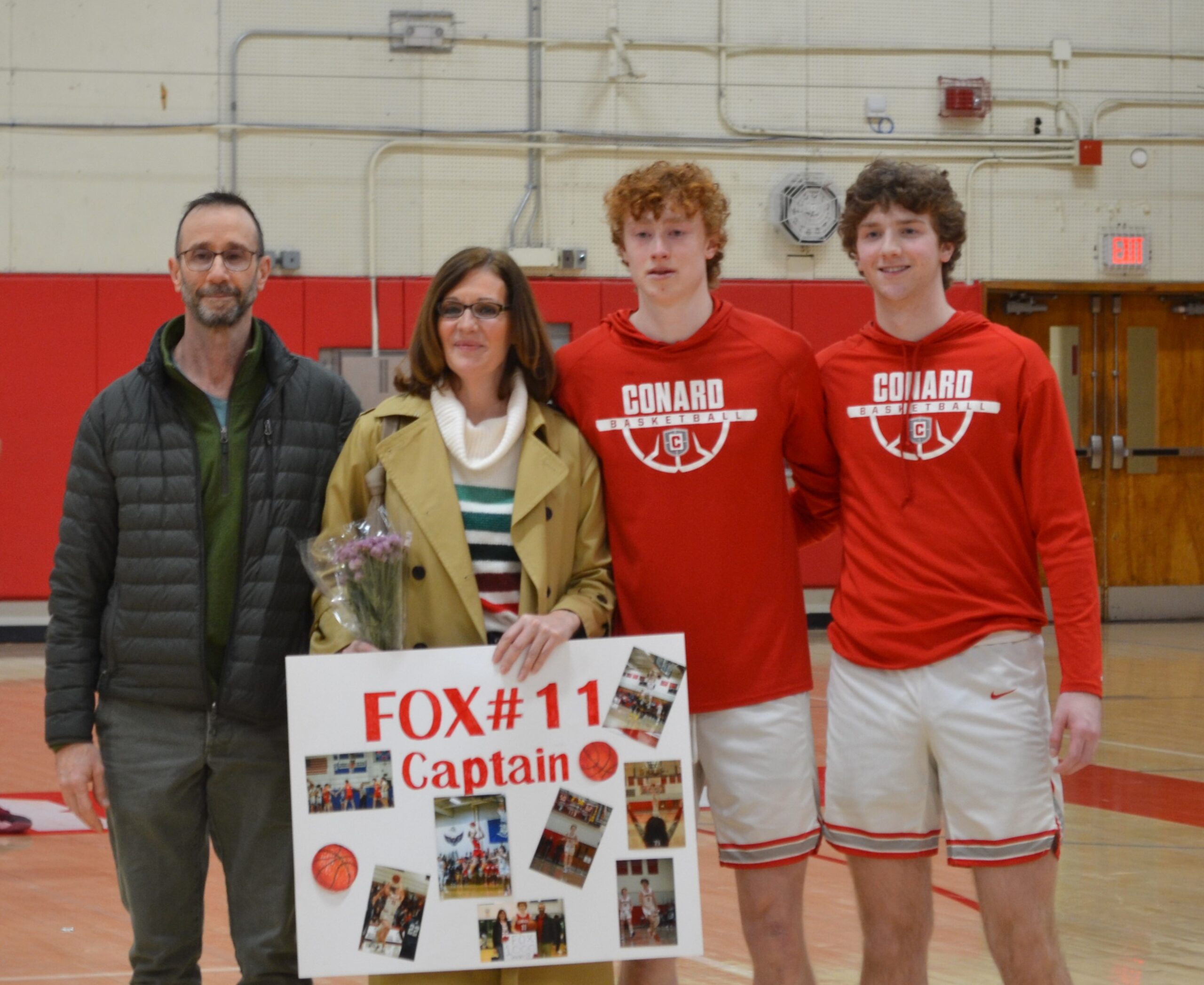 Riley Fox (center) with his parents and brother Aidan on Senior Night ...