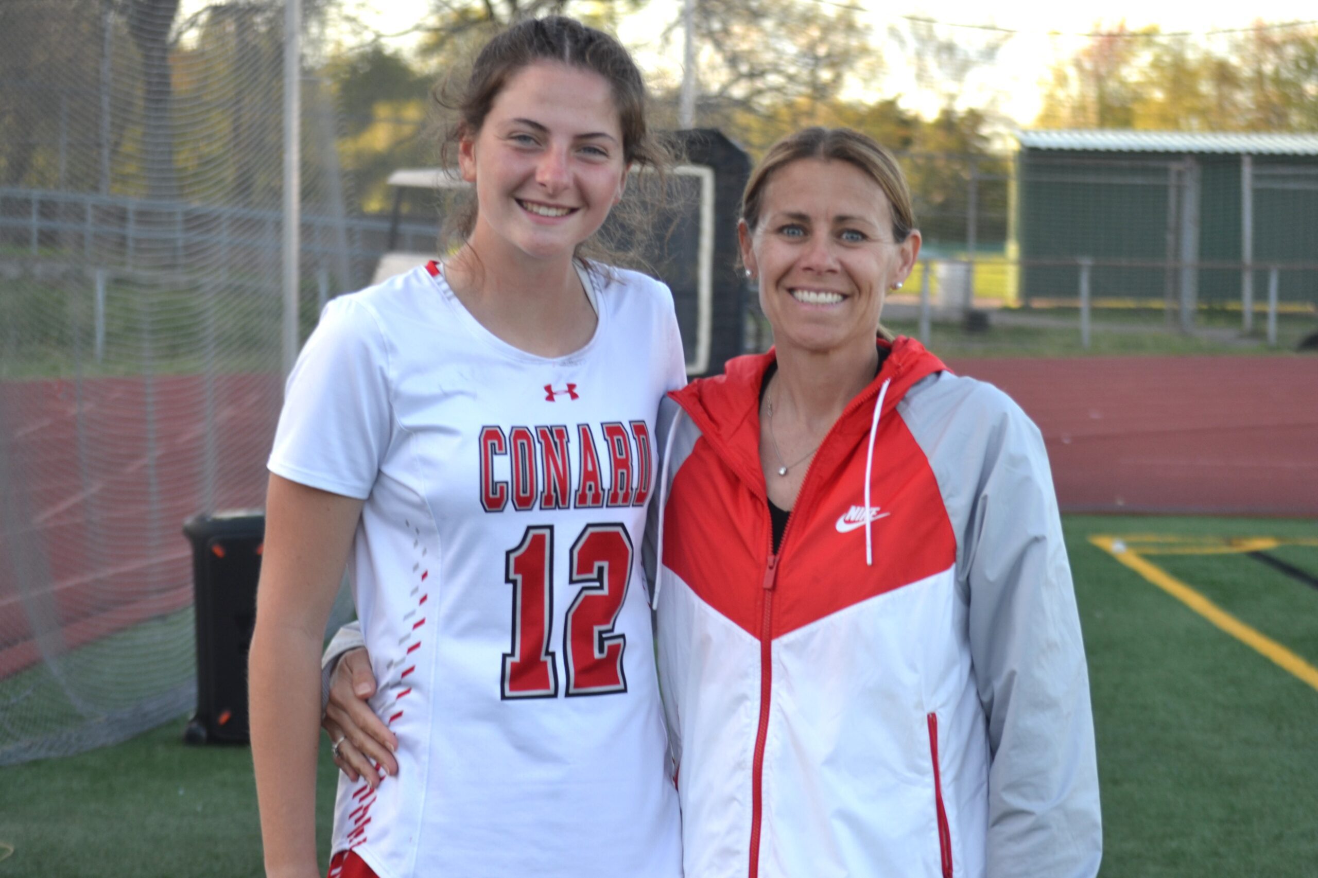 Nicole Gorman (l) scored her 100th career larosse goal at Conard. She is seen here with coach Meg Cersosimo