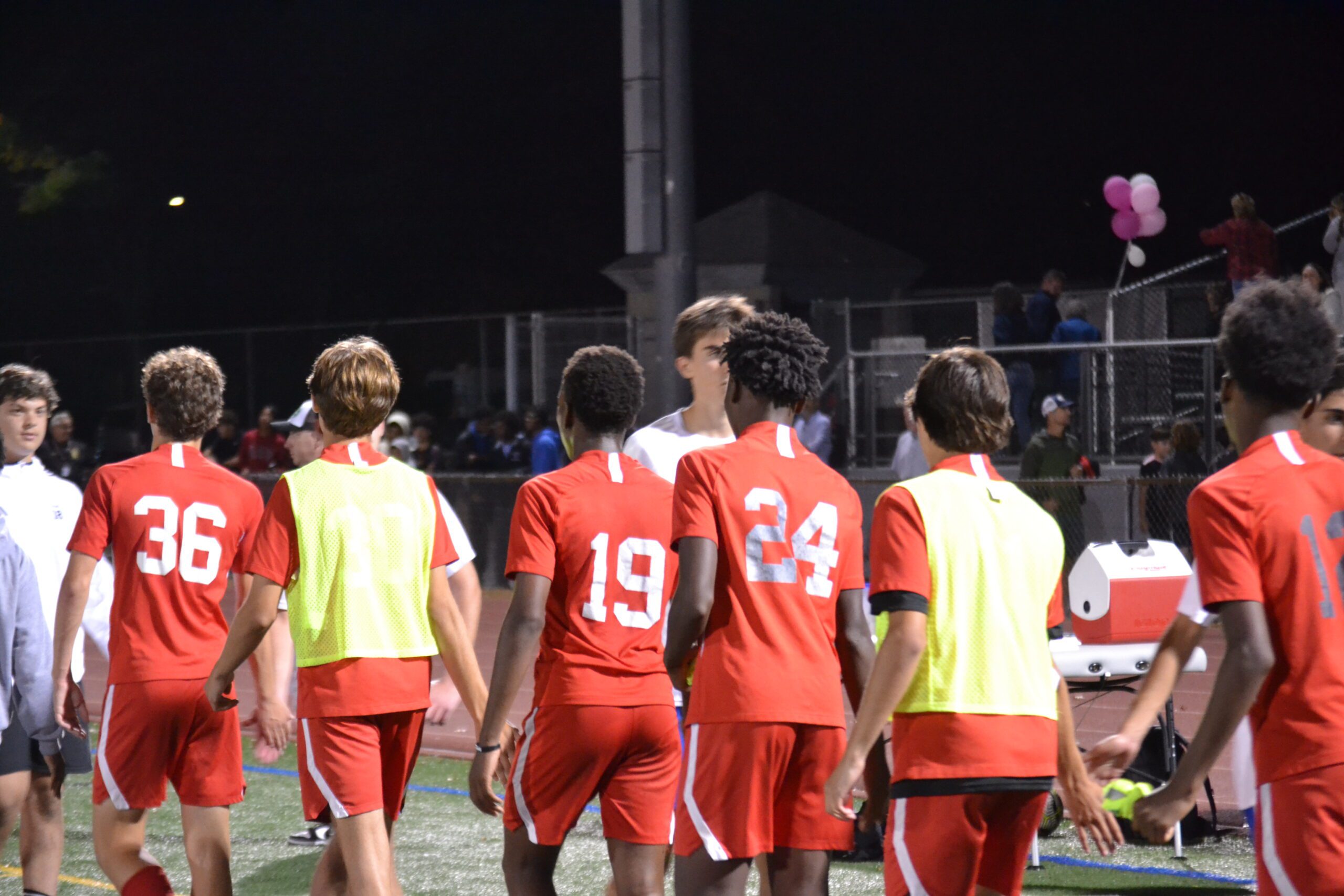 Conard and Hall players go through the handshake line after the game